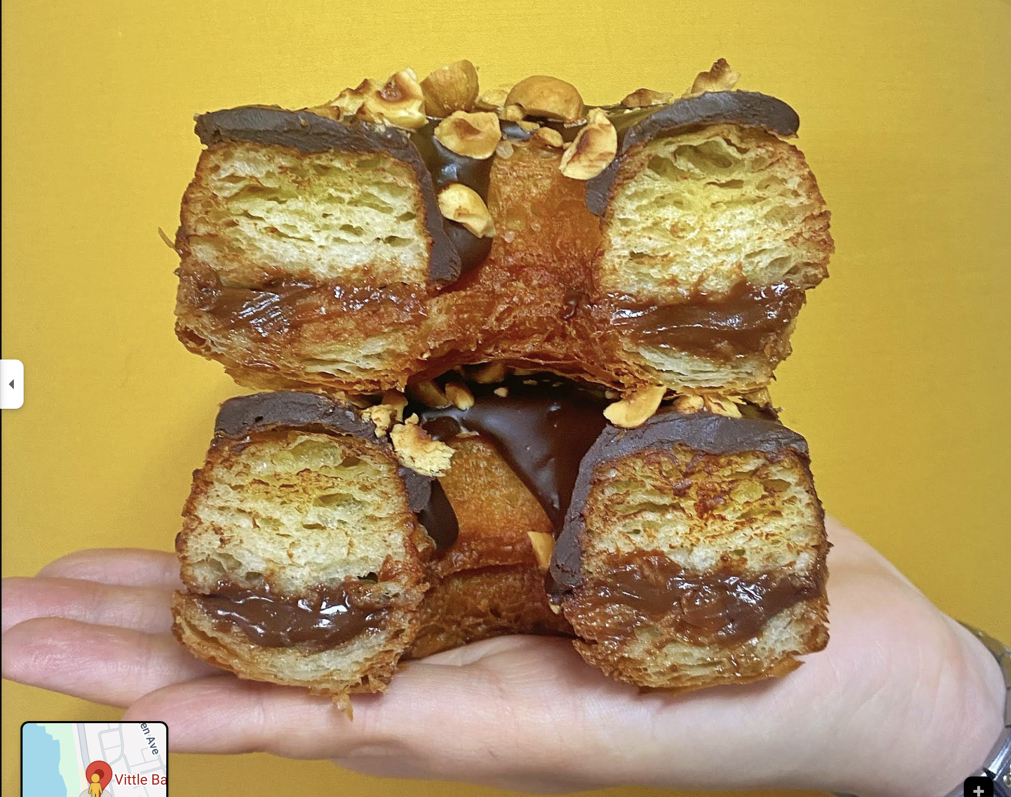 Chocolate hazelnut cruffin cross-section on yellow background