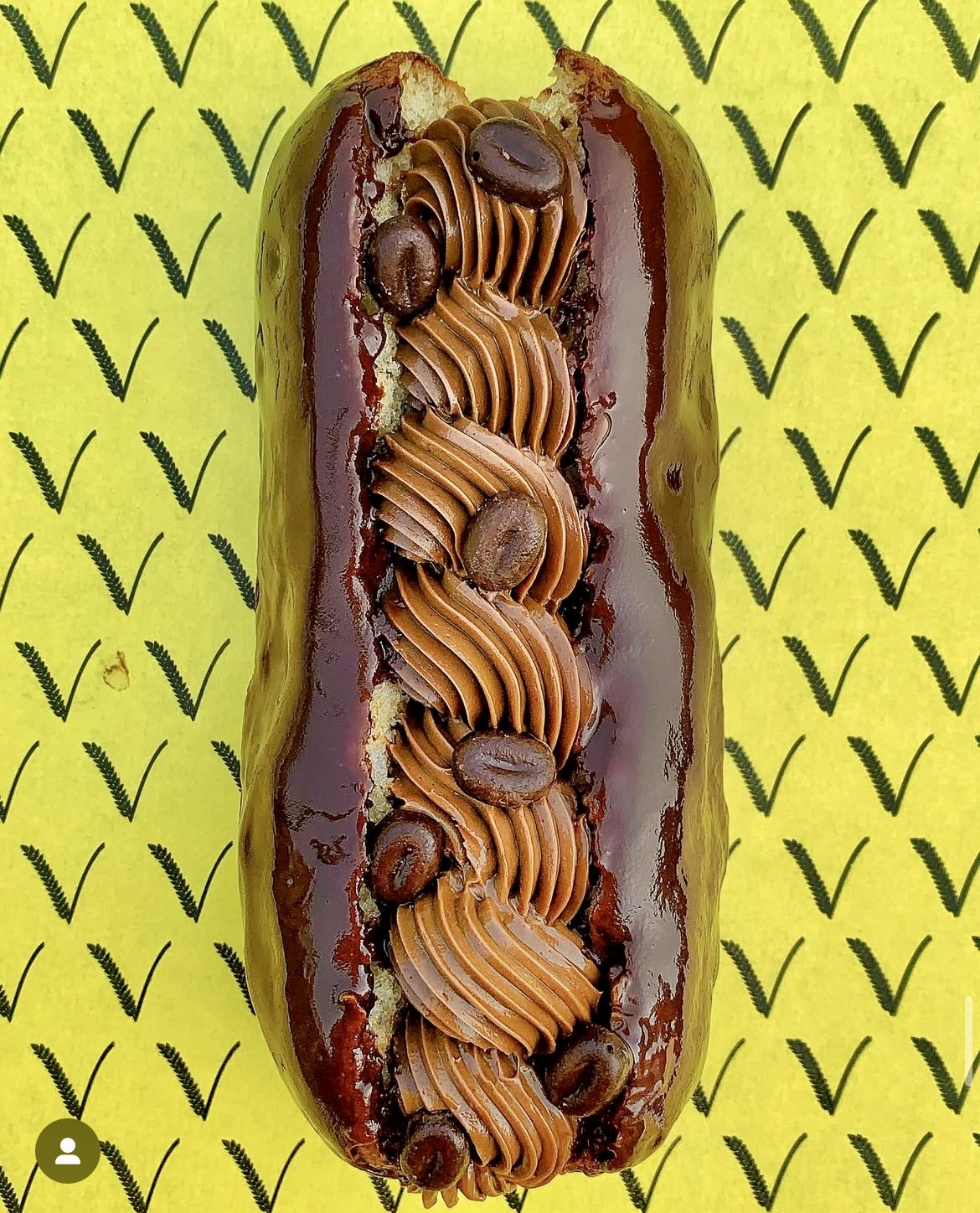 Coffee eclair with chocolate glaze on Vittle branded paper